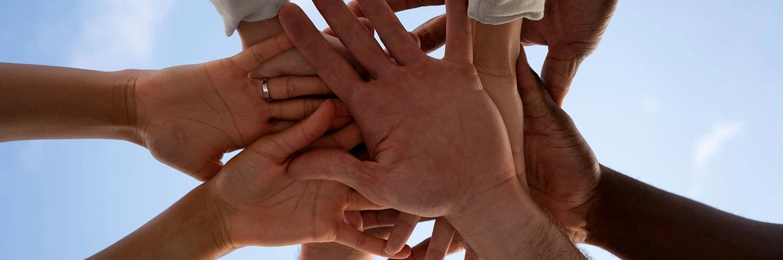 Diverse hands coming together